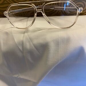 Purchased @ Simons, clear Aviator-style with bridge.
